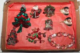 A box of Christmas brooches