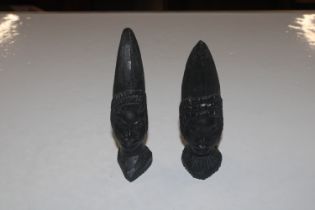 A pair of African carved wooden heads
