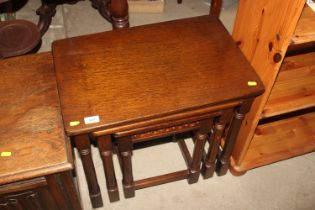 An oak nest of three occasional tables