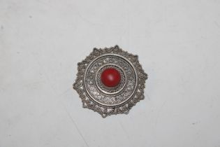 A vintage Sterling silver and coral brooch, approx