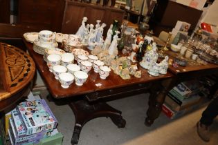 A 19th Century mahogany drop leaf supper table rai