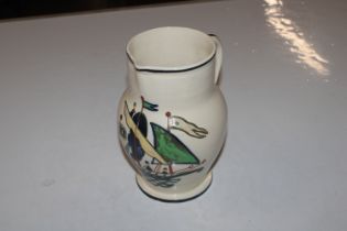 An Ashtead Pottery jug with hand painted decoratio