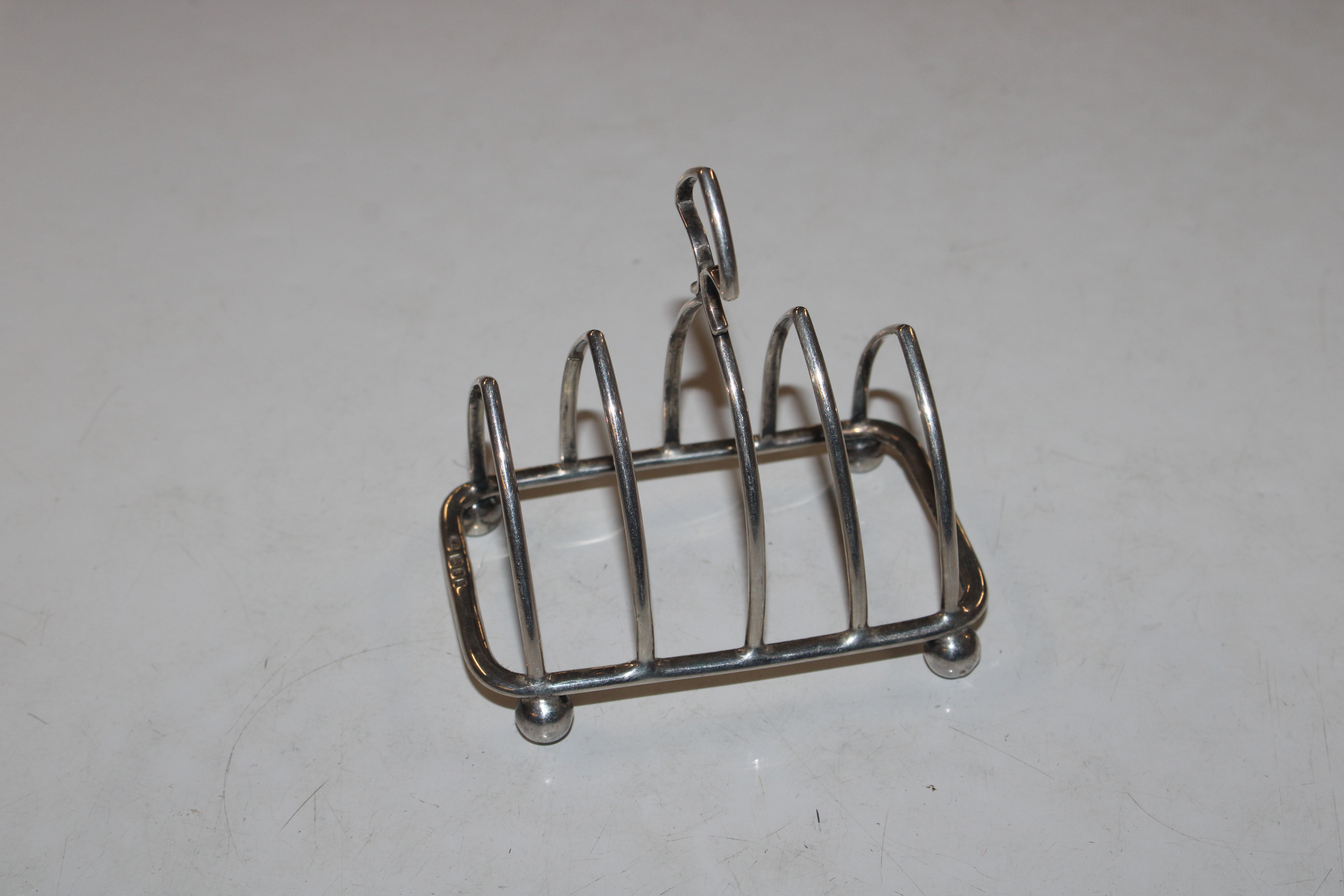 A silver four slice toast rack on four ball feet, - Image 2 of 3