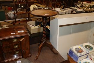 A 19th Century wine table raised on barley twist t