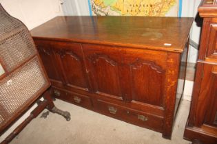 An 18th Century oak mule chest with hinged lifting