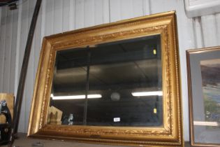 A bevel edged oblong wall mirror, contained in 19t