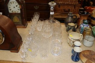 A cut glass decanter and stopper and a quantity of