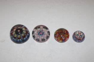 Four millefiori glass paperweights