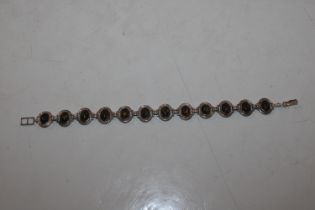 A Sterling silver and amber bracelet approx. 25gms