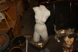 A sculpture in the form of nude female torso, rais