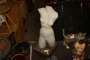 A sculpture in the form of nude female torso, rais