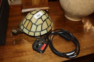 A table lamp in the form of a tortoise