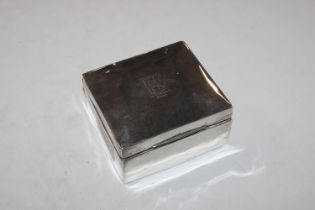 A silver cigarette box with wooden liner and a Ron