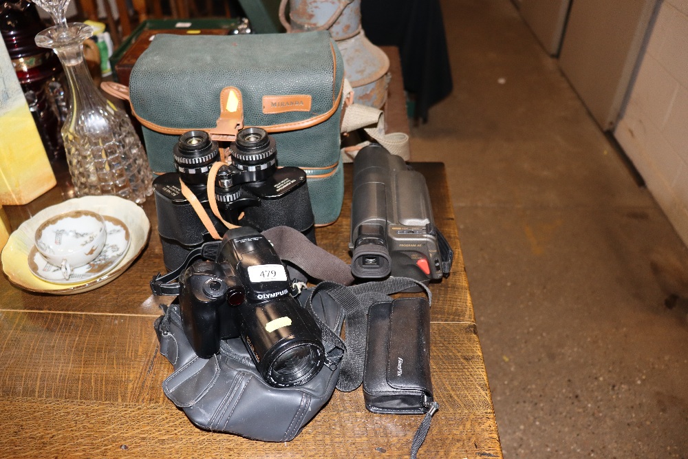 An Olympus IS-3000 camera; a pair of 8x40x50 binoc