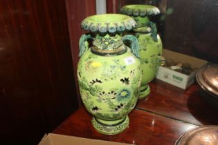 An Oriental green glazed baluster vase with floral