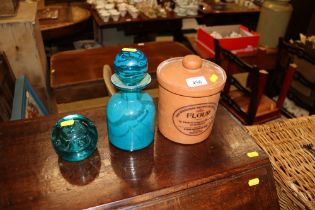 A Mdina type bottle and stopper and paperweight; and a Henry Watson storage jar and cover