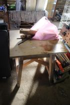 A wood calving work bench with accessories