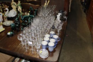 A quantity of various table glassware, coffee mugs