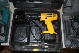 A DeWalt DW957 cordless electric drill with batter