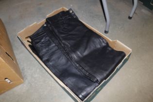 Three pairs of leather trousers