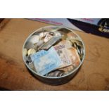 A tin of miscellaneous mostly foreign coinage and