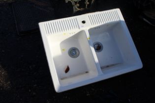 A large ceramic twin basin sink unit with single m