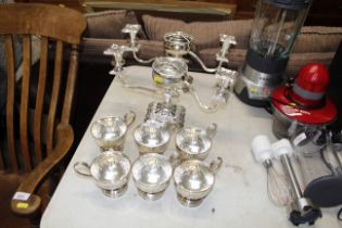 A pair of plated candelabra/flower holders and six