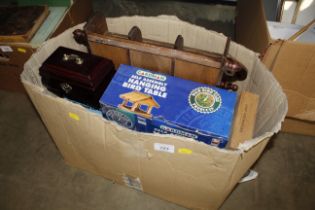 A box containing various trinket boxes, hanging bi