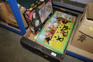 A box of miscellaneous games including Totopoly
