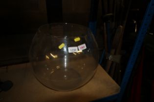 A large glass open topped fish bowl
