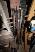 A quantity of vintage wooden shafted golf clubs