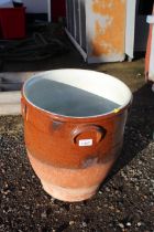 A half glazed terracotta plant pot