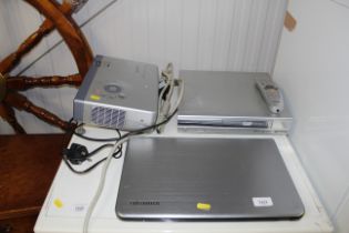 A Toshiba laptop; and a Sanyo projector