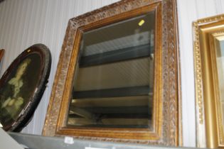 A gilt framed bevel edged wall mirror