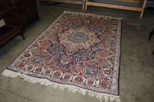 An approx. 8'6" x 5'9" Eastern patterned rug