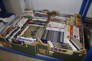 Two boxes of miscellaneous DVDs etc.