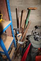 A quantity of wooden long handled garden tools to