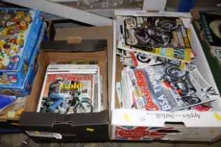 Two boxes of motorcycle magazines