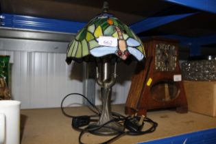 A table lamp with Tiffany design dragonfly shade