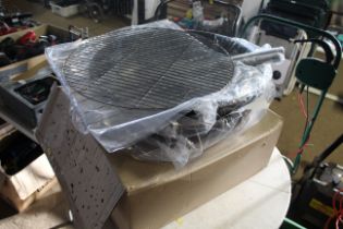 A Russel charcoal bbq as new with original box and