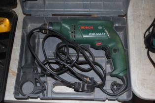 A Bosch PSB600RE 240v electric drill in fitted pla