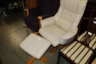 A cream leather reclining swivel chair and footsto