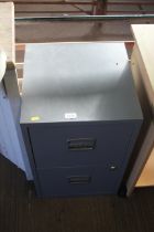 A metal two drawer filing cabinet