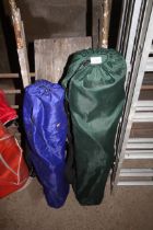 Two folding camping chairs in carry bags