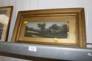 A small gilt framed oil on board of a cottage