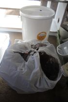 A fermentation bucket and a quantity of plastic be