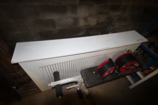 A white painted wooden radiator cover