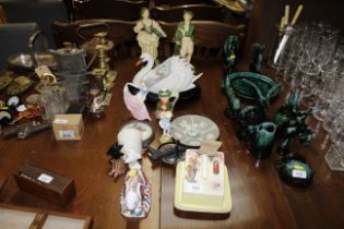 A collection of various pottery figures, animal or