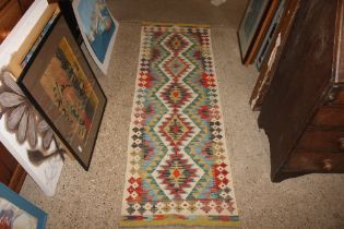 An approx. 6'4" x 2' Chobi Kelim runner