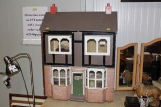 A dolls house including some contents